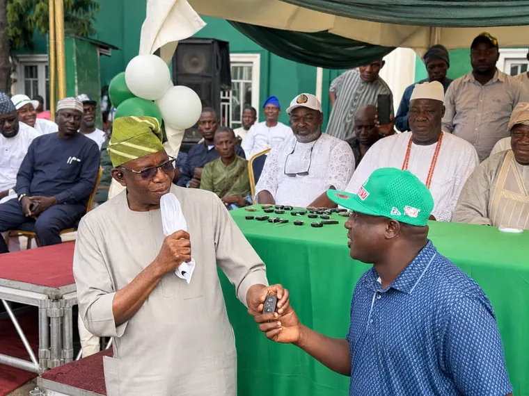 A beneficiary showing appreciation after receiving a vehicle.