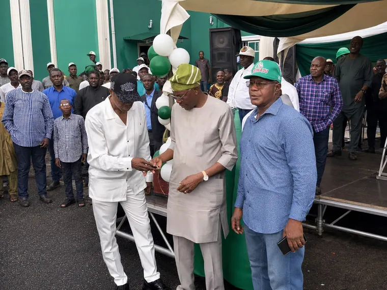 Presenting a car key to a beneficiary.