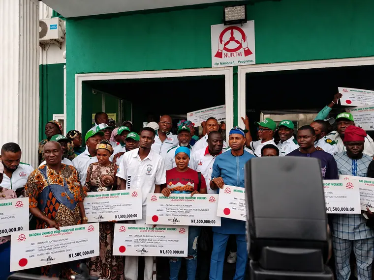 Presentation of cash gifts to families of deceased NURTW staff.