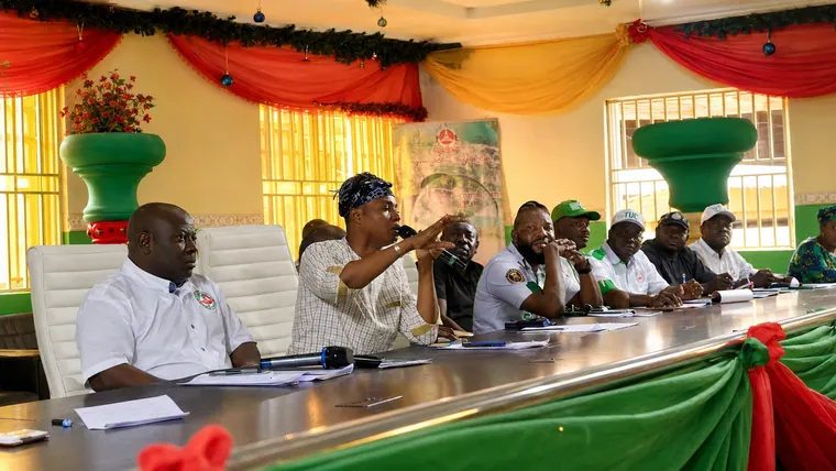 Addressing NURTW members during an official office meeting.