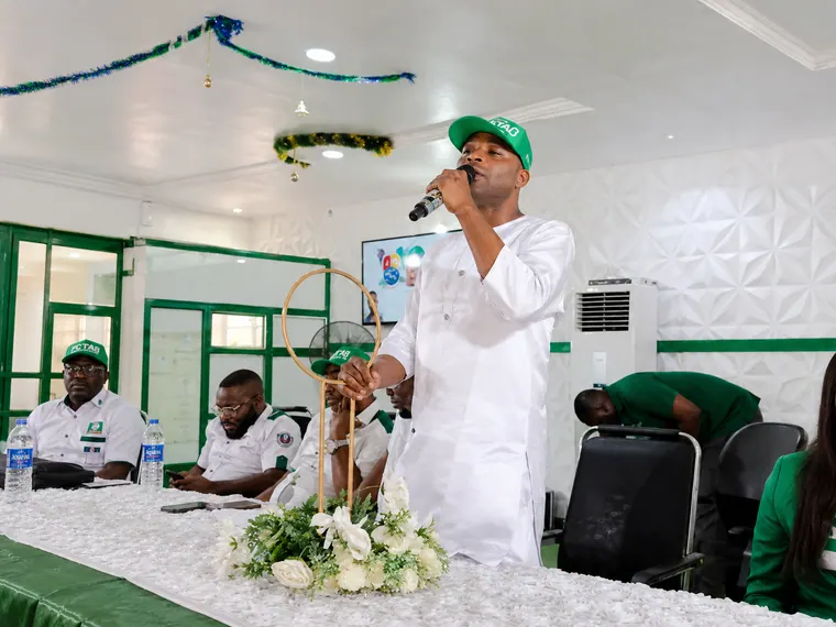 Addressing association staff at the office event hall.