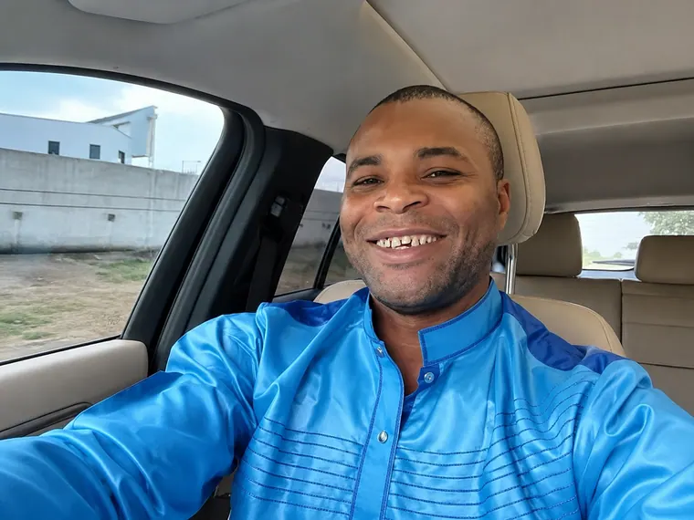 A candid moment inside his car.